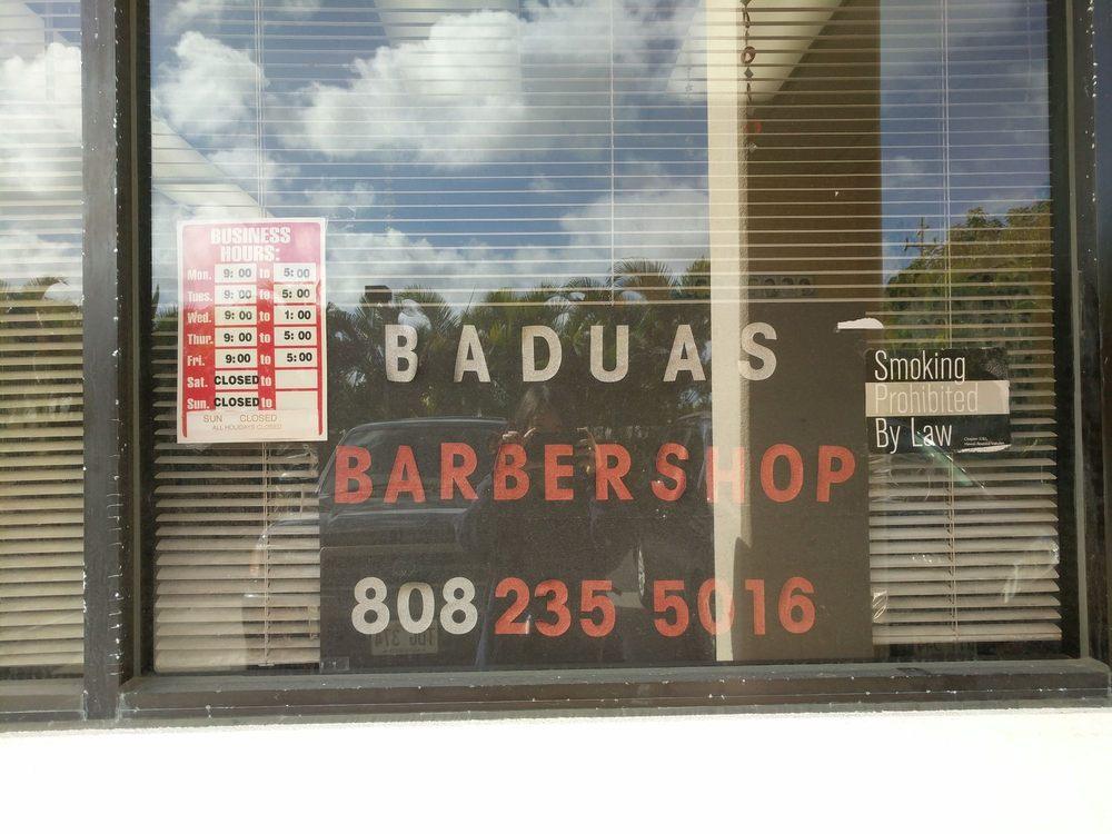 The front window of Badua's Barbershop